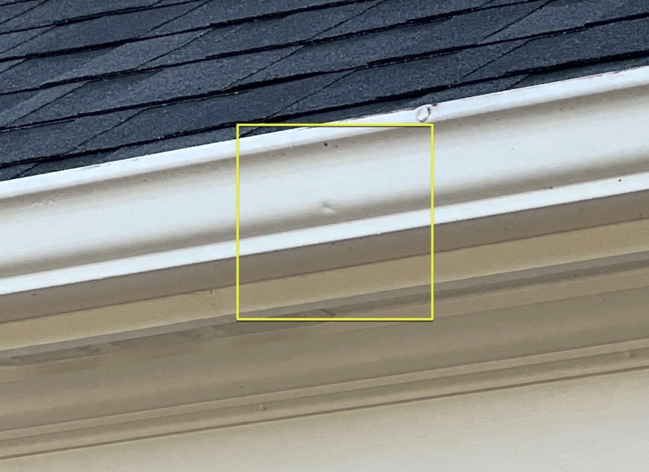 Hail dent to gutter