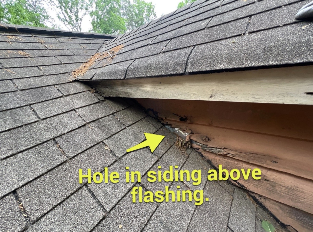 Hole in siding above wall flashing