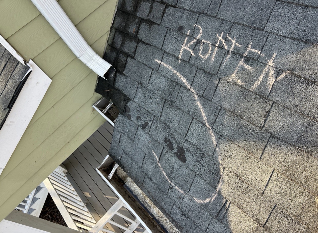 Rotten decking where downspout drains onto roof