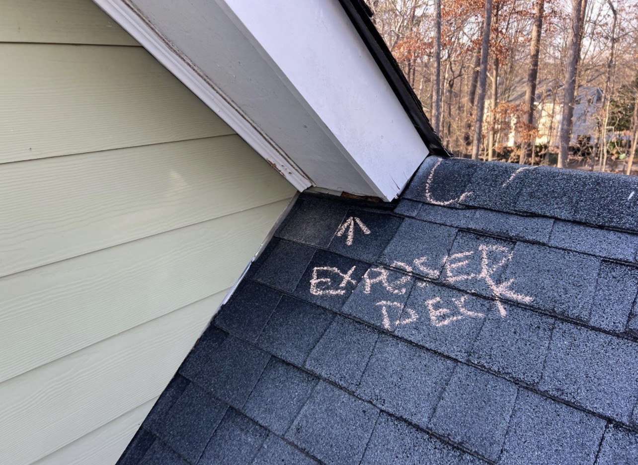 Exposed decking near soffit roofline