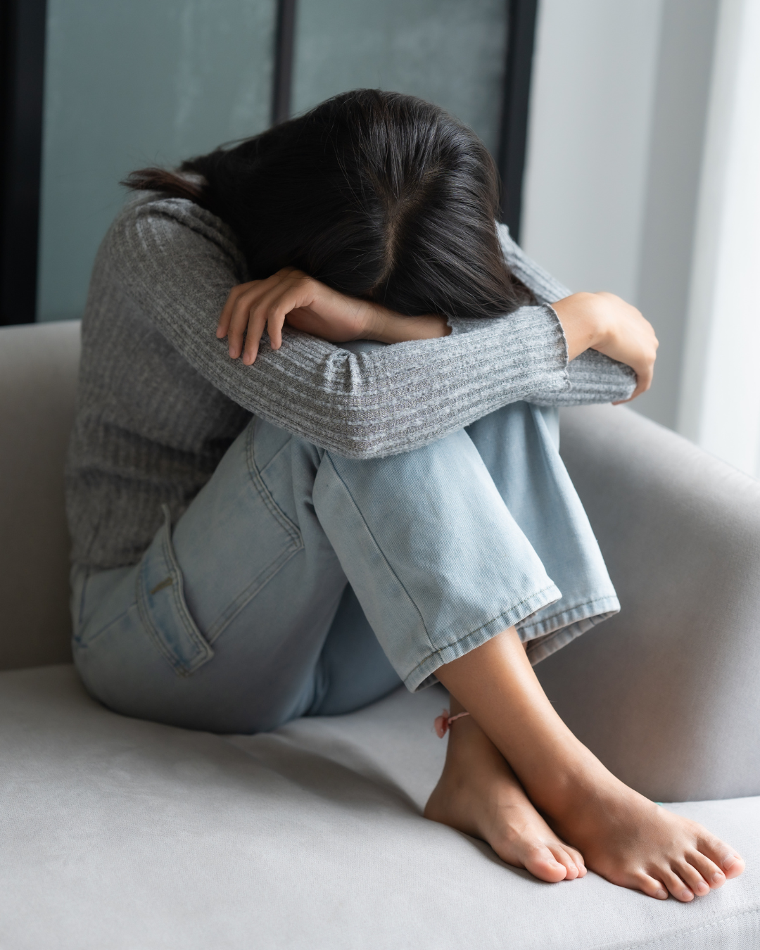 A person experiencing the weight of depression, considering EXOMIND therapy