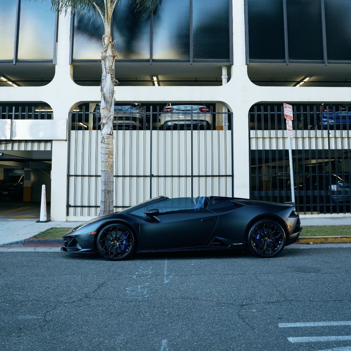 Matte black Lamborghini Huracan EVO Spyder side