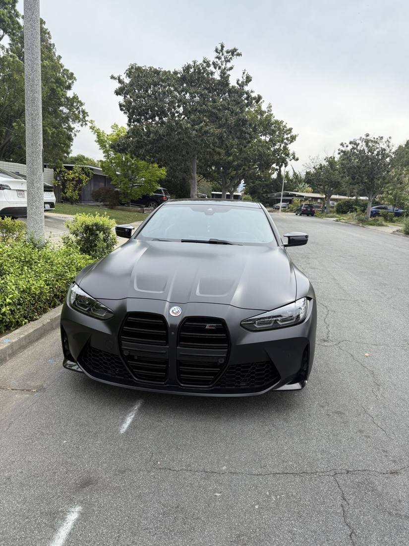 Matte black BMW M4 Competition front