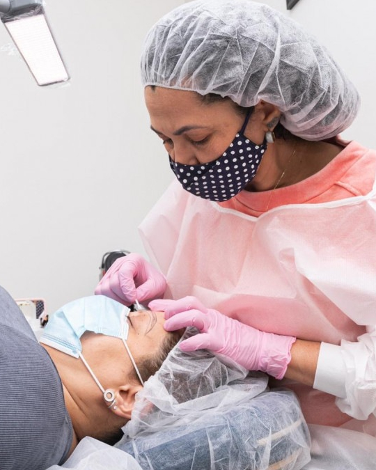 Lucia Santana working on a microblading client in her Chagrin Falls studio