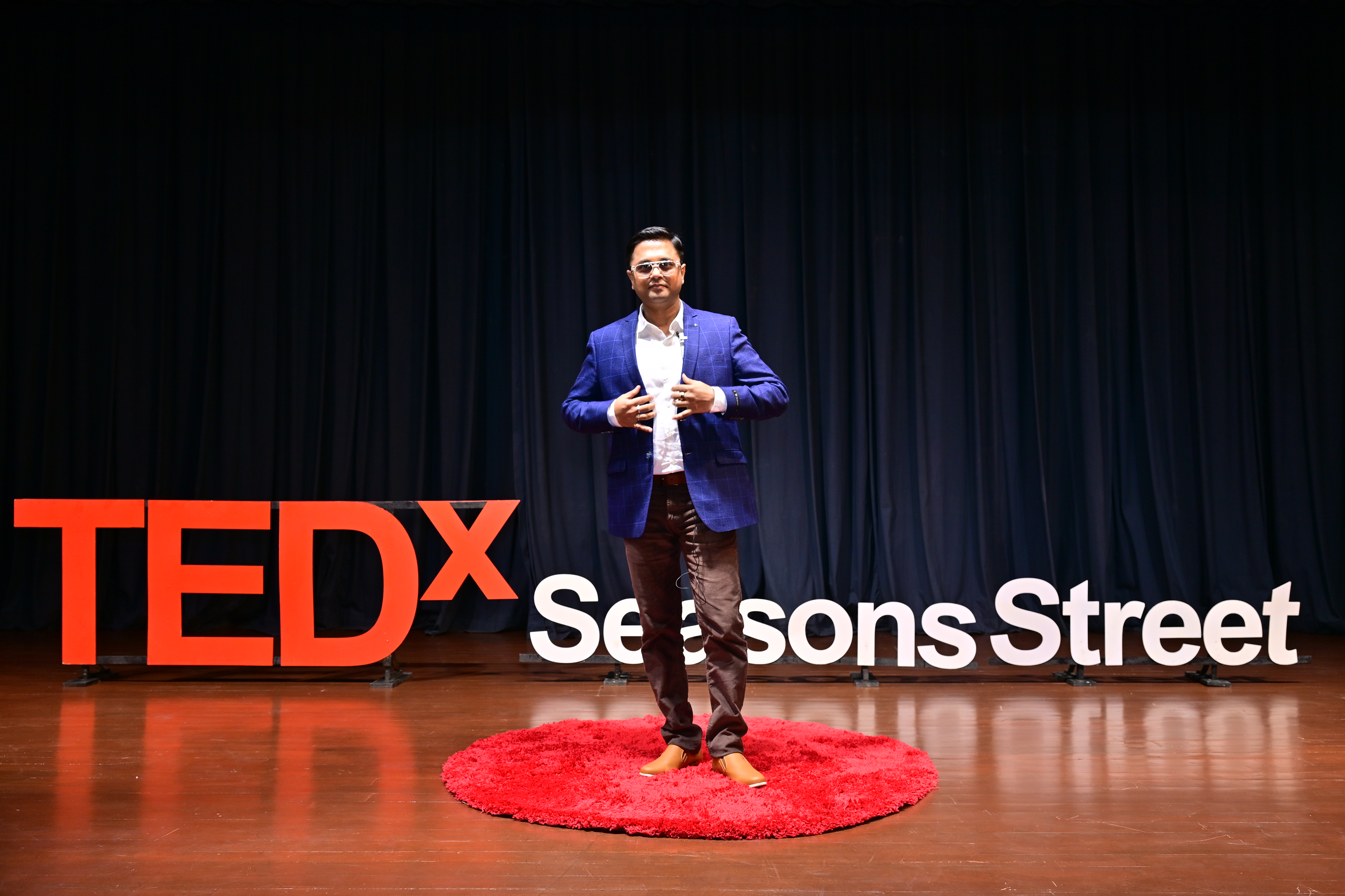 Subhash Kartik speaking on the TEDx stage