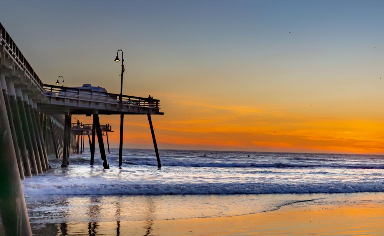 Sunset at the Pismo Beach Pier, waves rolling under the pilings