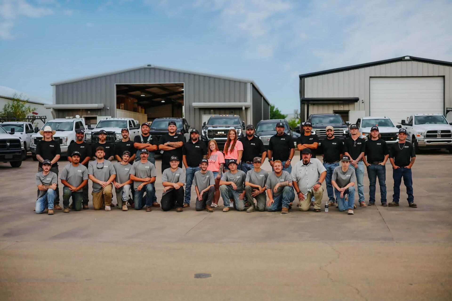The Okie Plumbing and Utilities crew and truck fleet at the shop in Stillwater, Oklahoma