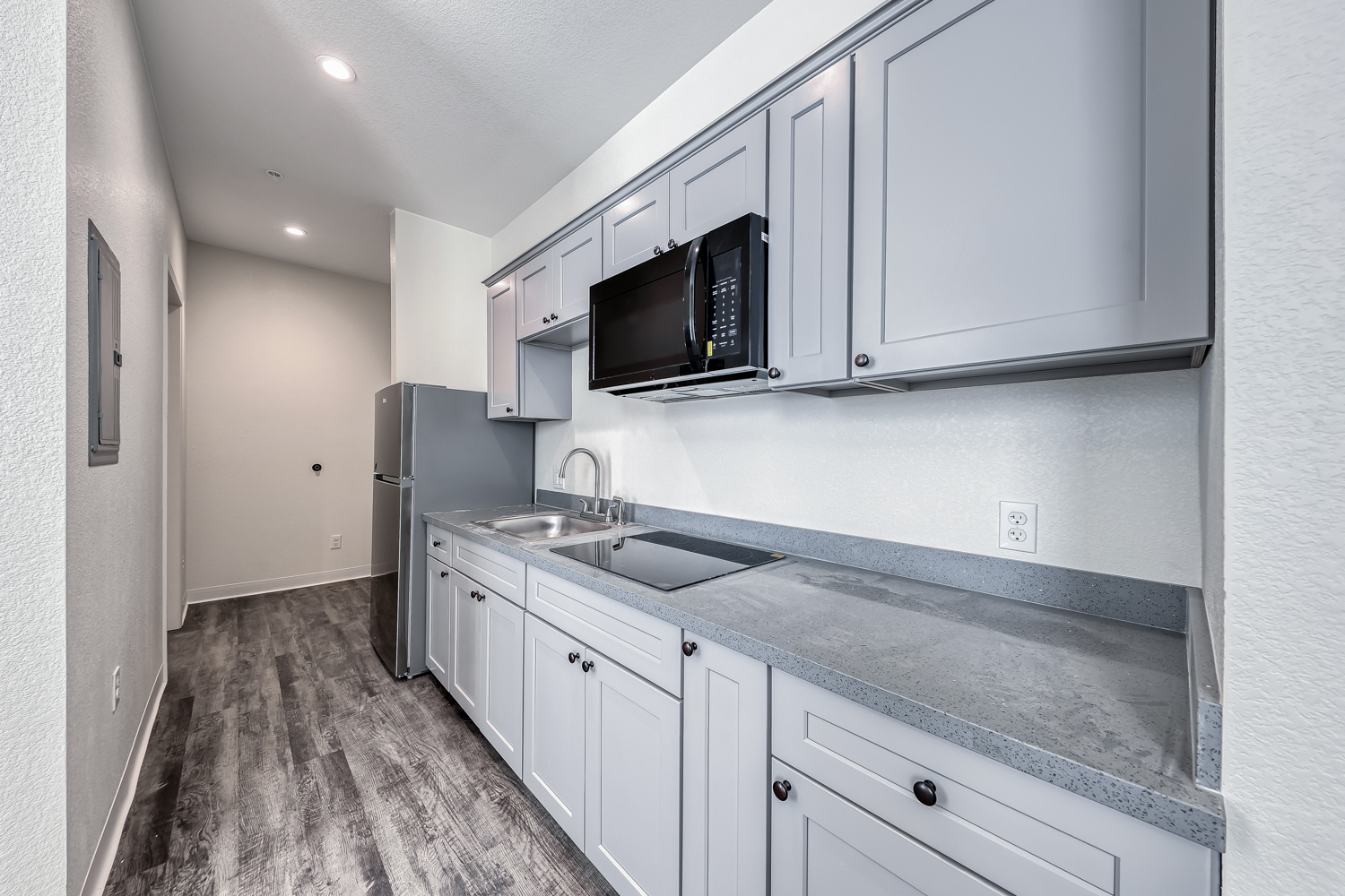 Kitchen with gray cabinetry