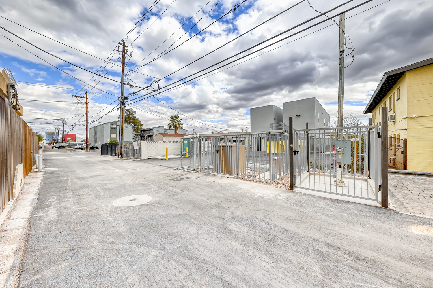 Gated rear parking area off the alley