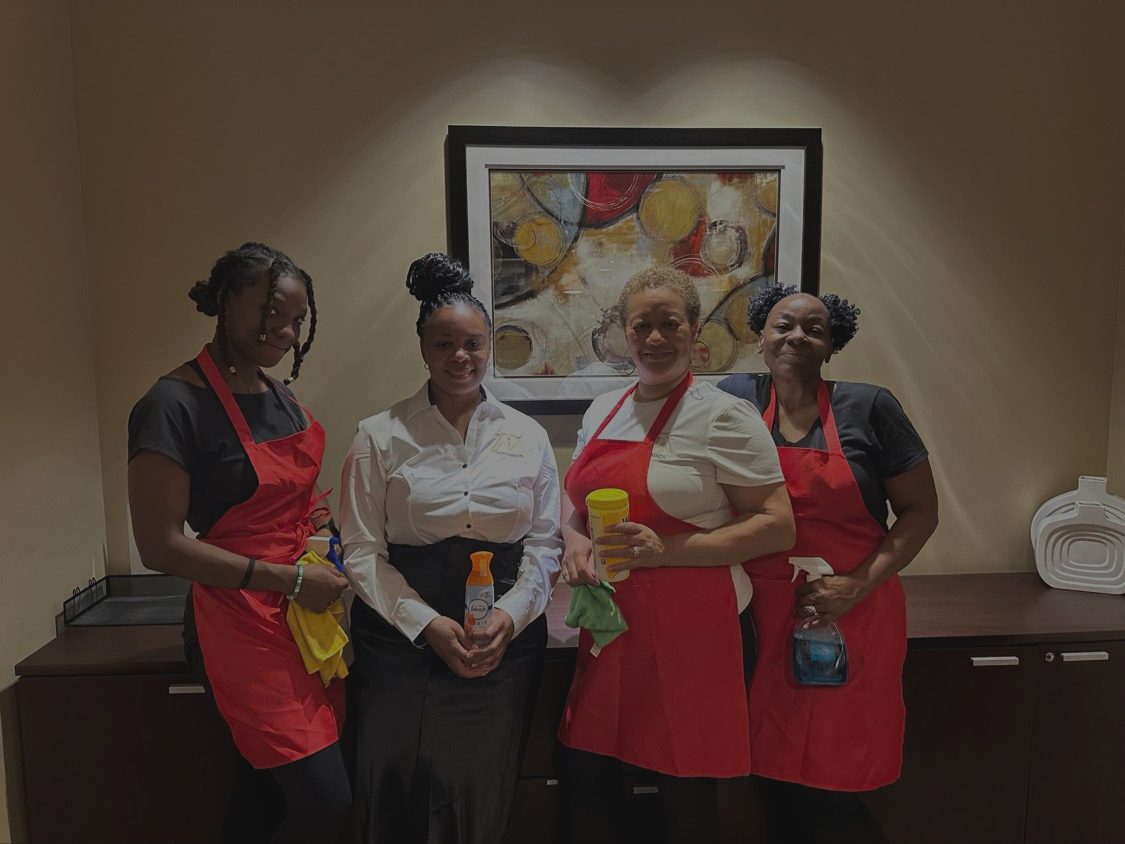 Mack Maids team members in a client lobby