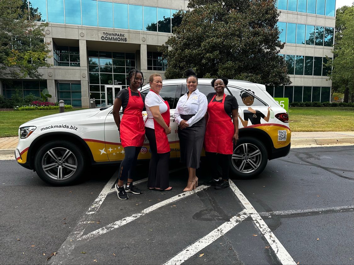 The Mack Maids team outside a client office building