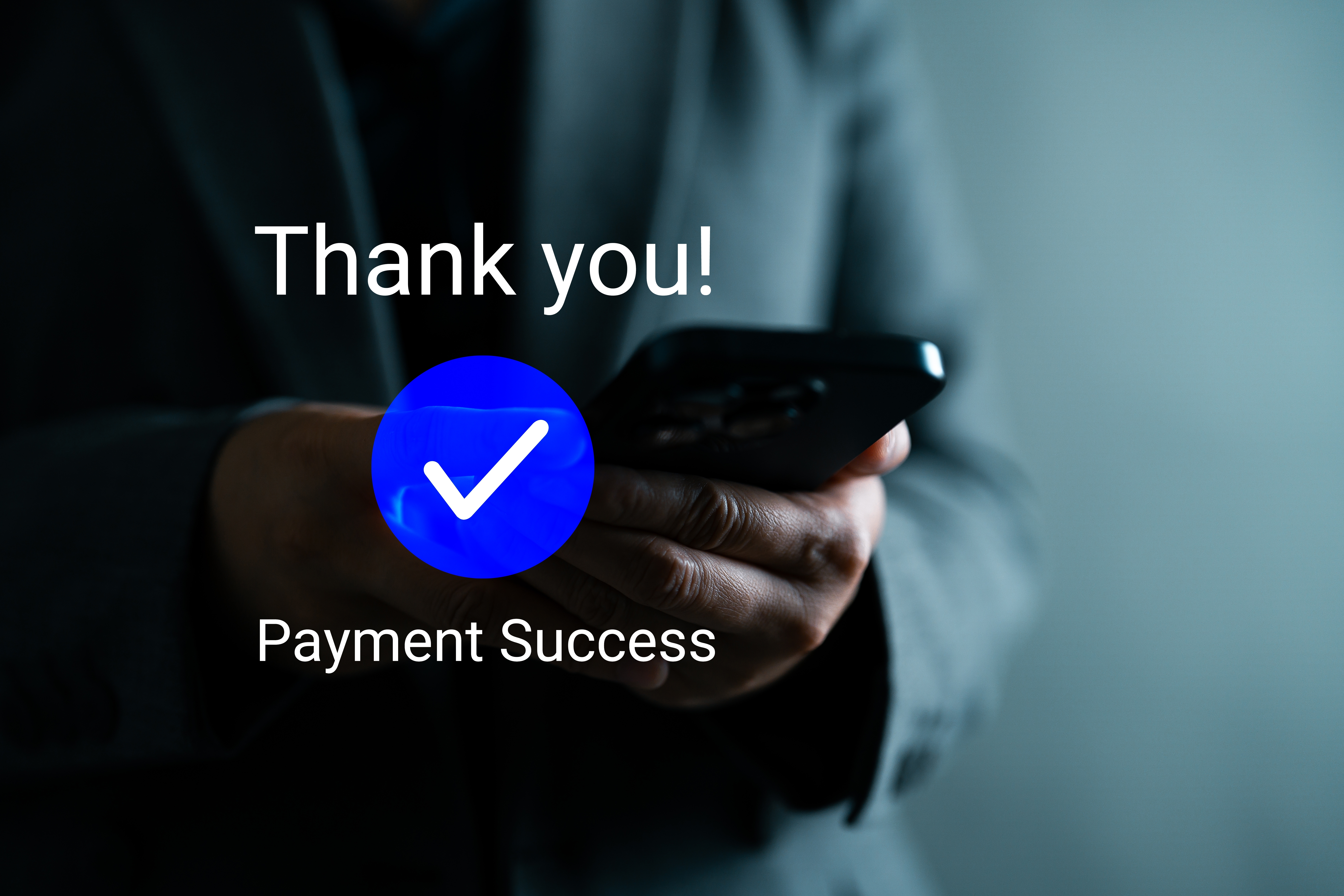 Hand holding phone receiving payment notification