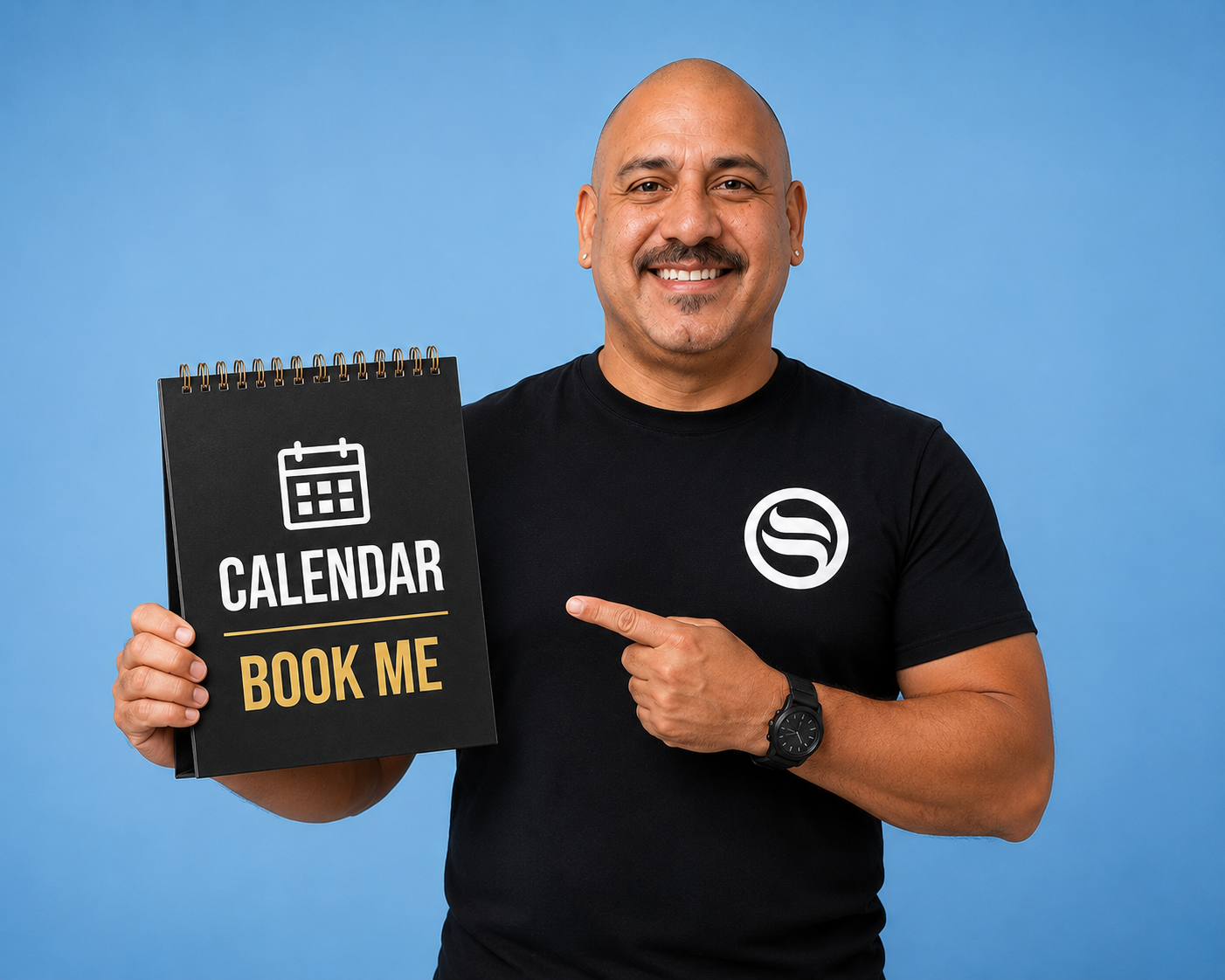 Ignacio Mendoza Martinez holding a sign that reads Book Me