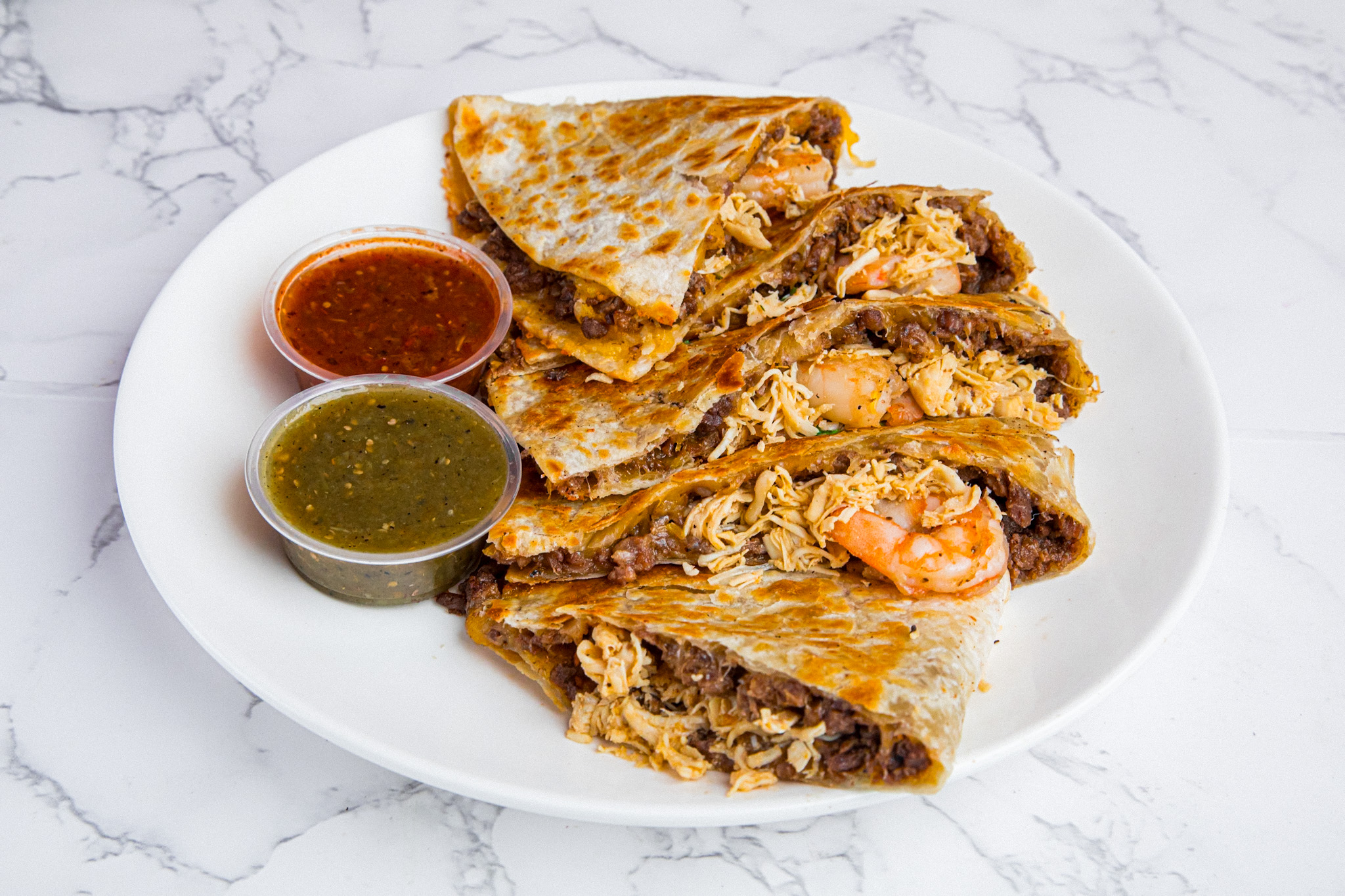 Taco Mell quesadilla with melted cheese blend and protein