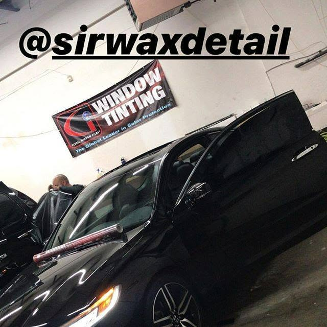 Window tint being installed on a black sedan at Sir Wax A-Lot Detailing in Capitol Heights, MD