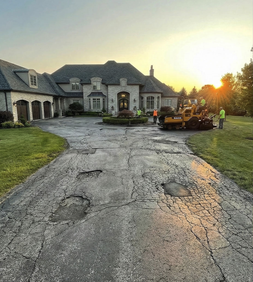 Before — deteriorated asphalt surface