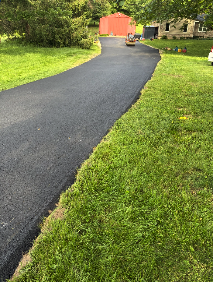 Freshly paved asphalt parking lot by Legacy Paving Co. in Saint Charles, MO