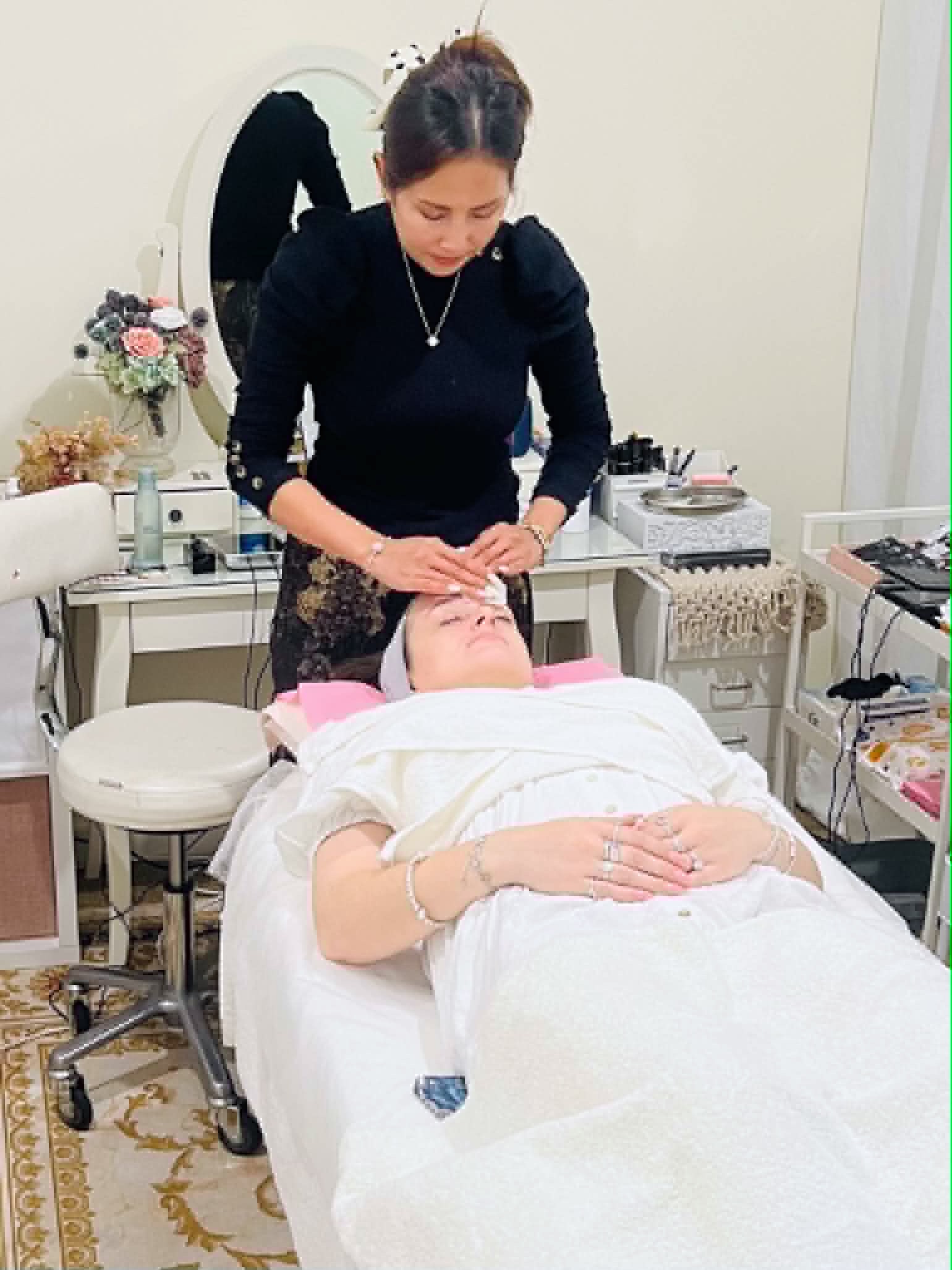 Public facial treatment scene shown at original aspect ratio