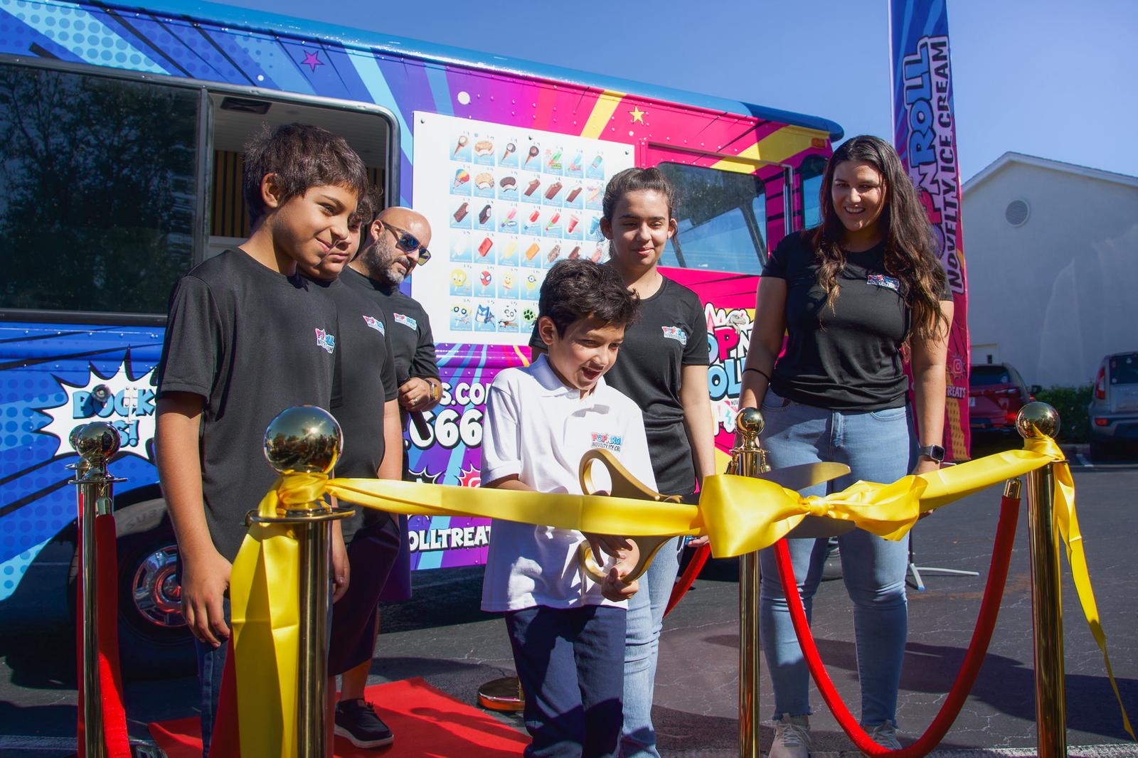Kevin cutting the ribbon on our grand opening