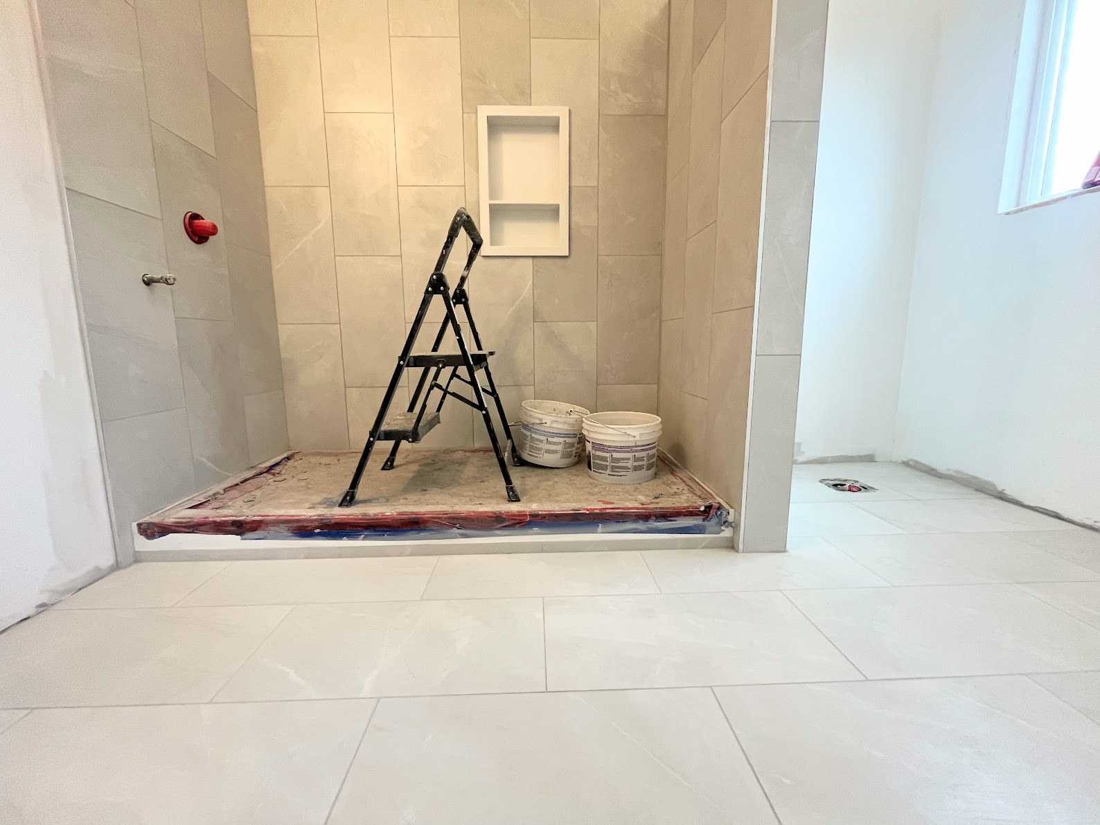 Near-complete bathroom with new tub and tile