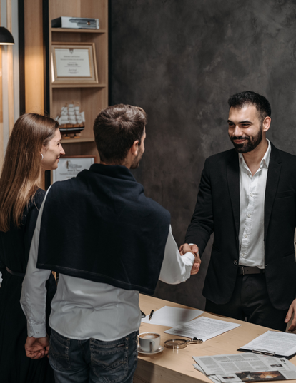 person using both laptop and smartphone