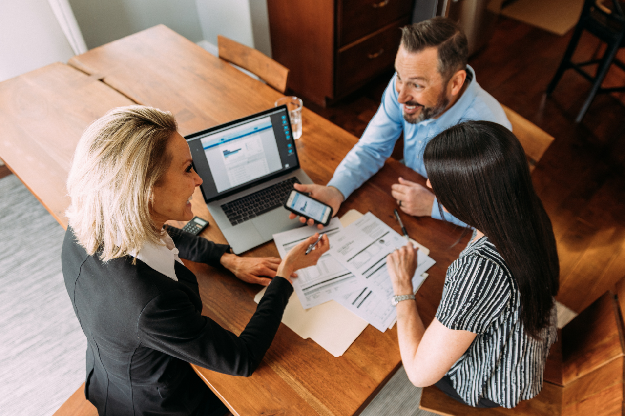 three white CCTV cameras mounted on wall