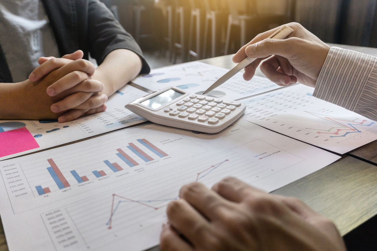 a group of coins sitting on top of a reflective surface
