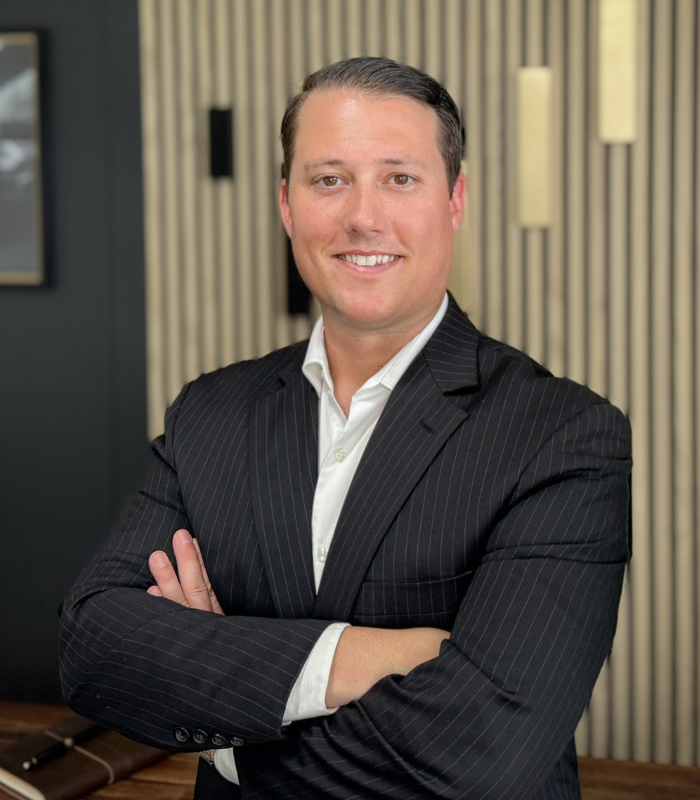 person using both laptop and smartphone