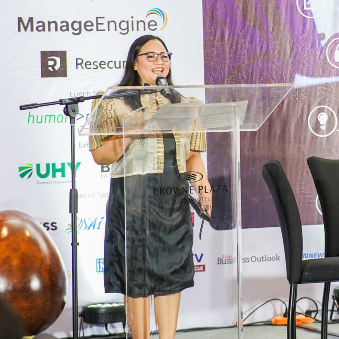A speaker in action at a past summit