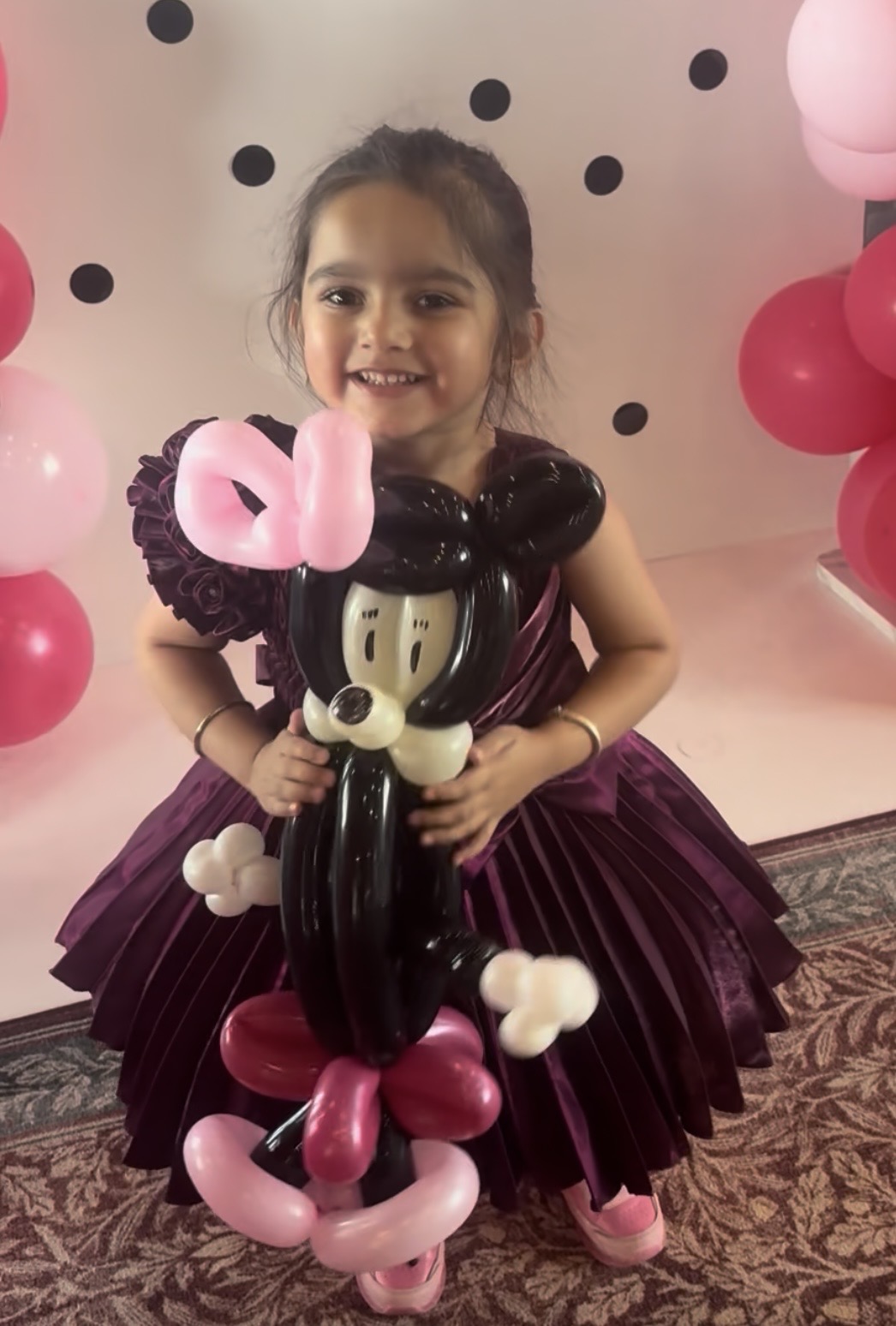 Child holding balloon art by Keir Royale