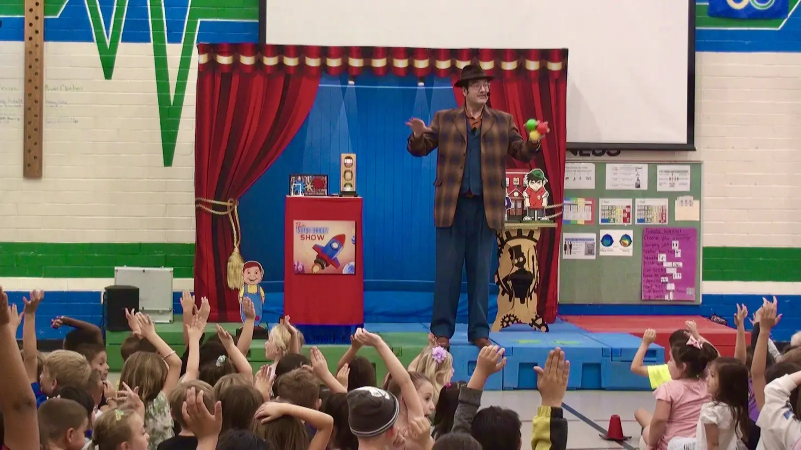 Keir Royale performing a school assembly magic show in Denver