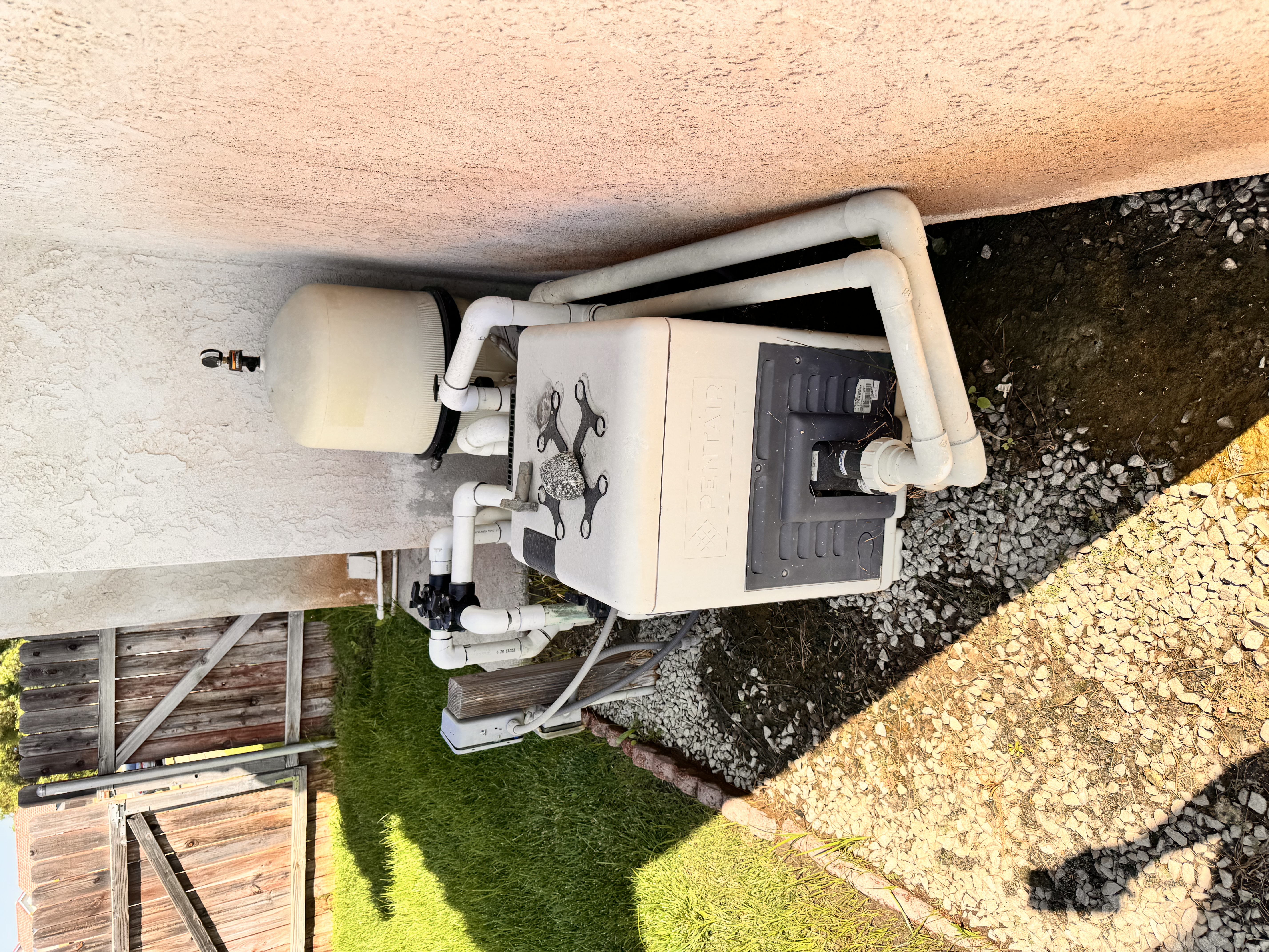 Pro 1 Plumbing technician working on pool pump and pipe system