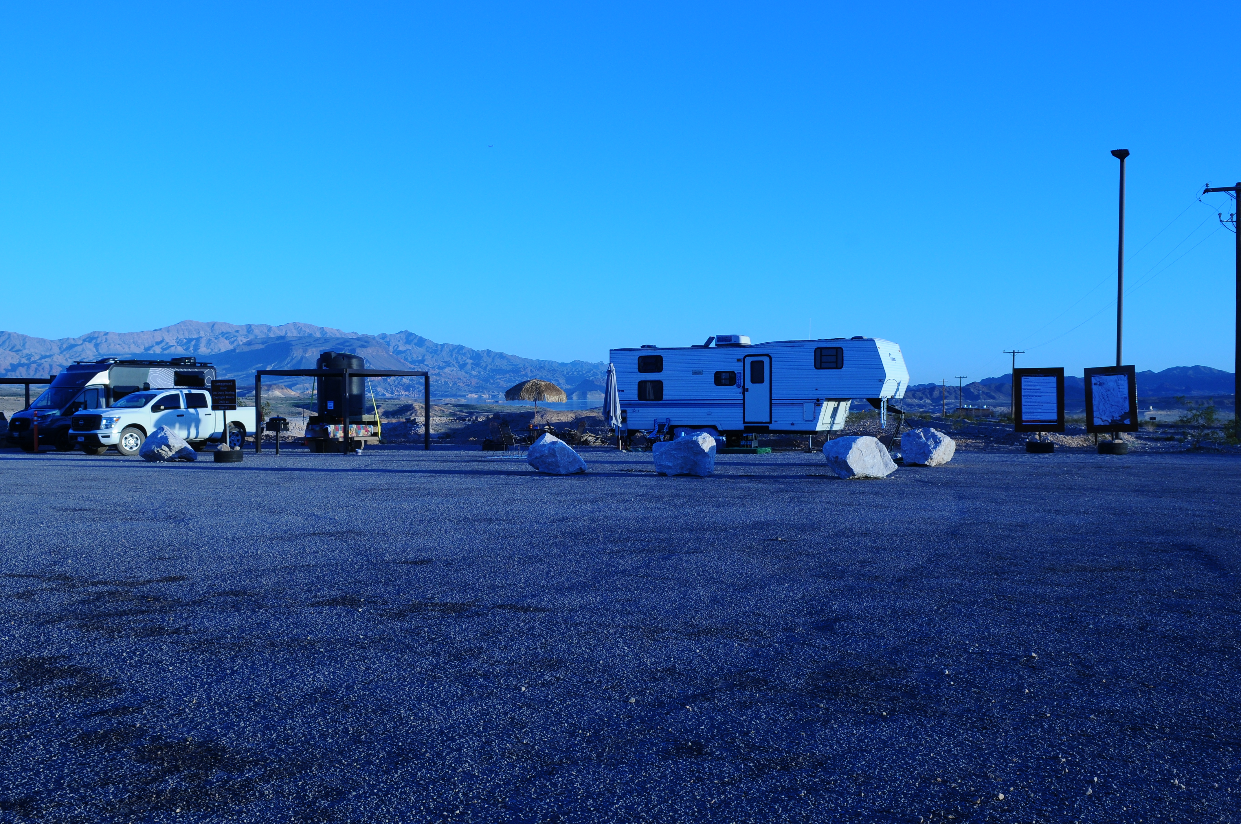 Self-contained RVs parked in designated primitive sites overlooking Lake Mead