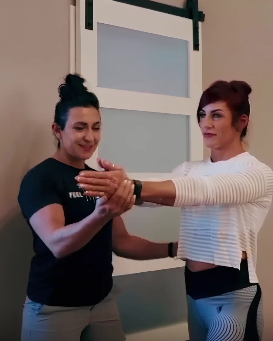Dr. Christina guiding a patient through a movement