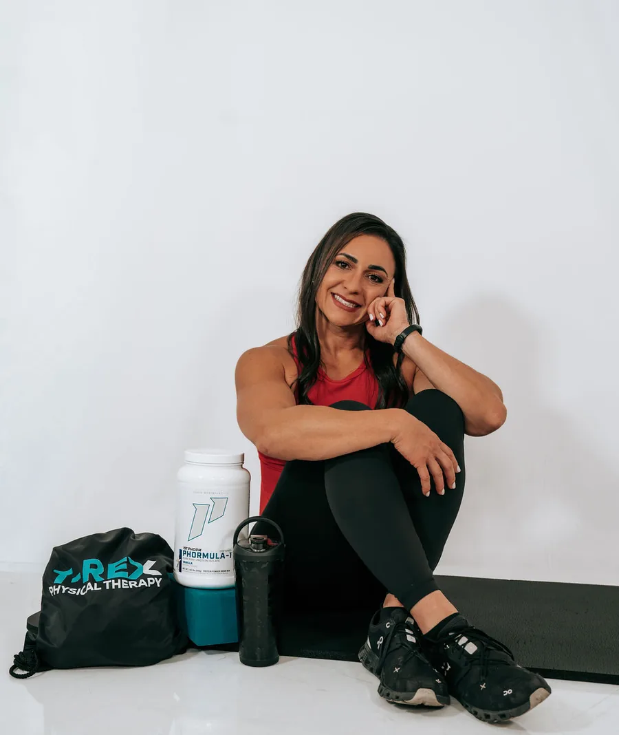 Dr. Christina with T-REX nutrition supplements and a branded kit bag