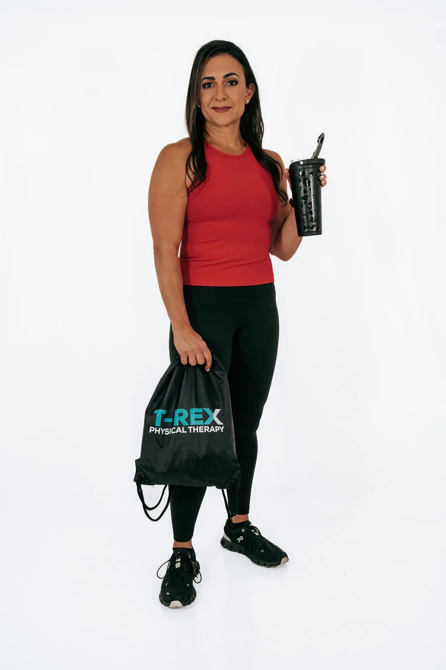 Dr. Christina with a T-REX training bag and water bottle
