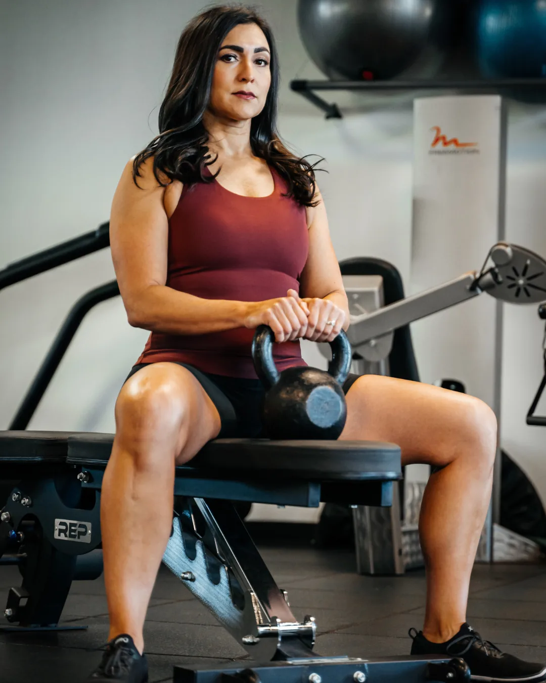 Dr. Christina training on a rowing machine