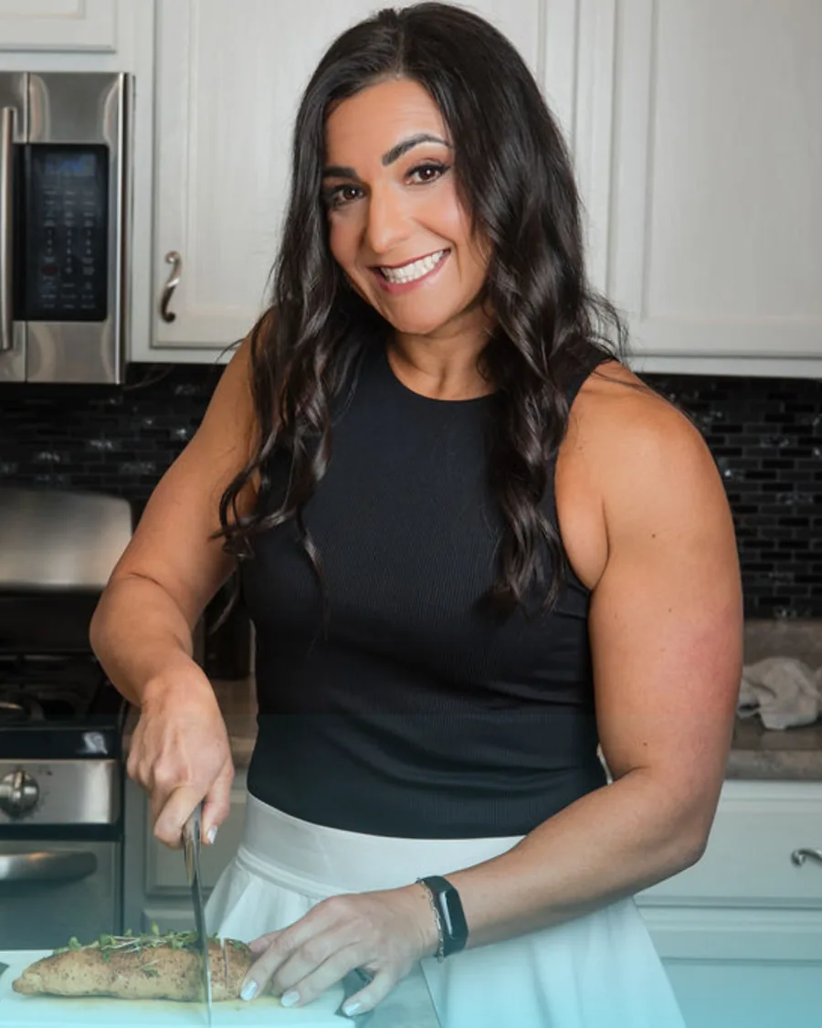Dr. Christina preparing a high-protein meal in her kitchen