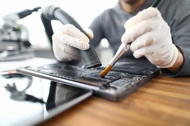 Computer repair technician working on hardware