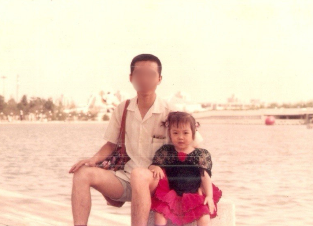 Claire as a child with her father