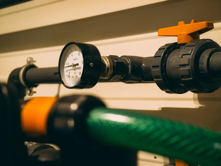 Pressure gauge and ball valve on a water line