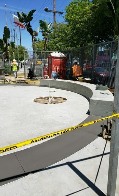 A modern circular concrete park installation in progress