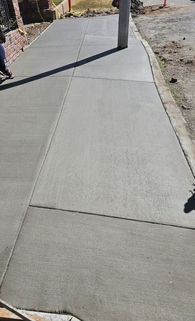 A smooth and durable freshly poured concrete sidewalk