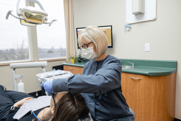 A multigenerational family relaxing together in the Orchard Heights Dental waiting area