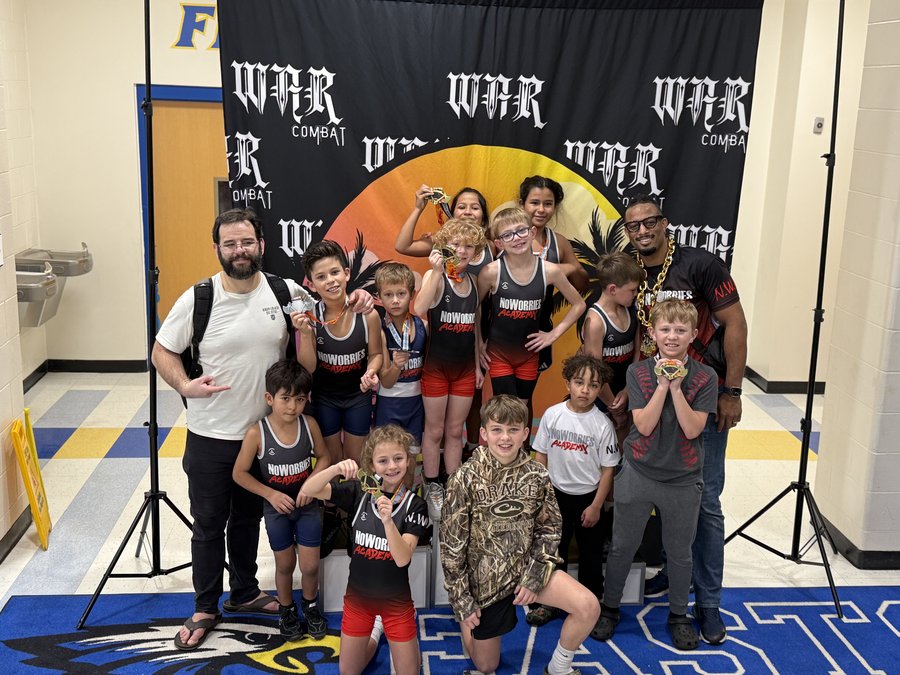 NoWorries Academy youth wrestling team with medals at WAR Combat
