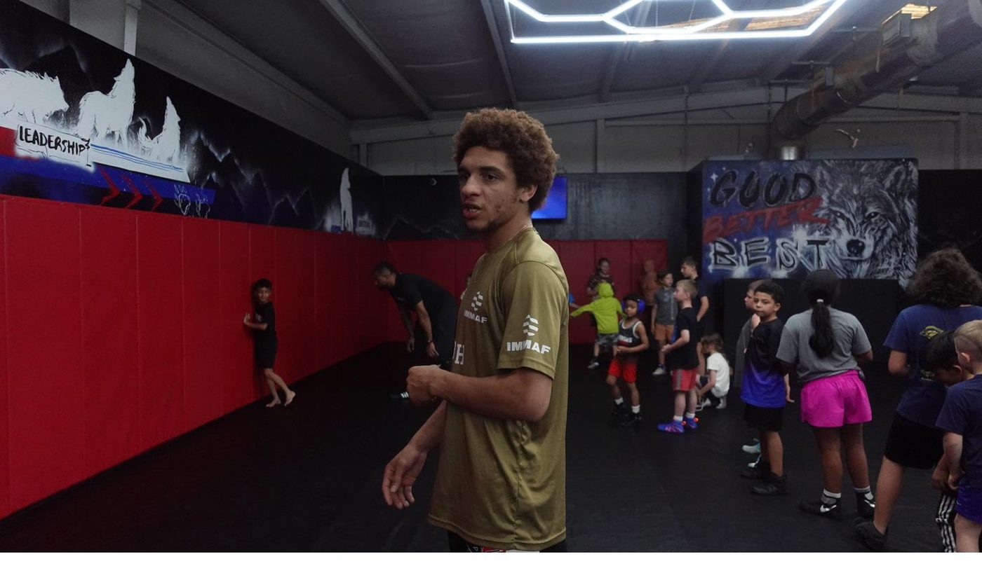 Coach teaching young student one-on-one