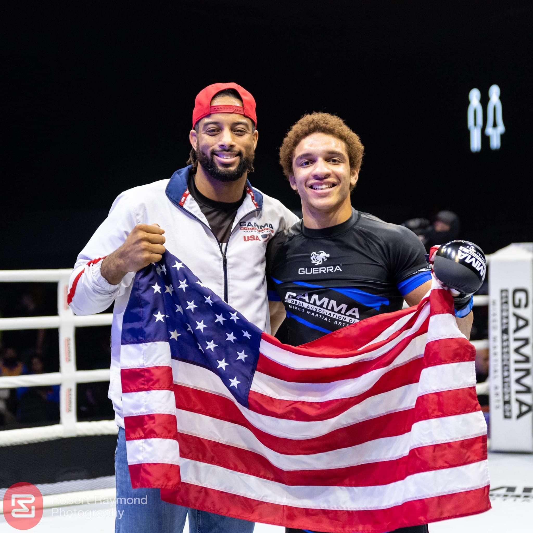 Coach Karl and Majid Corbett celebrating with American flag