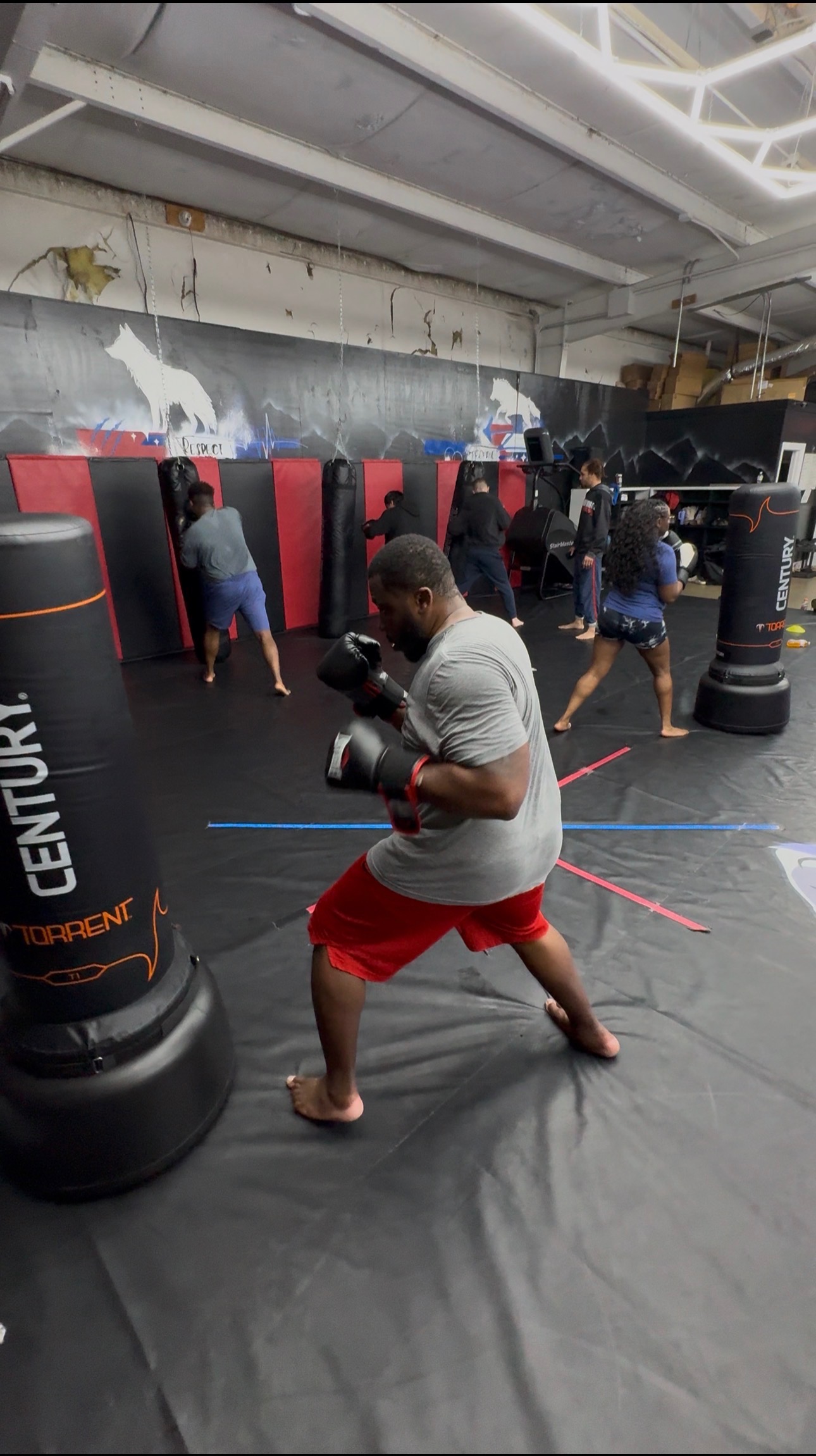Adult kickboxing class on the bags at NoWorries Academy