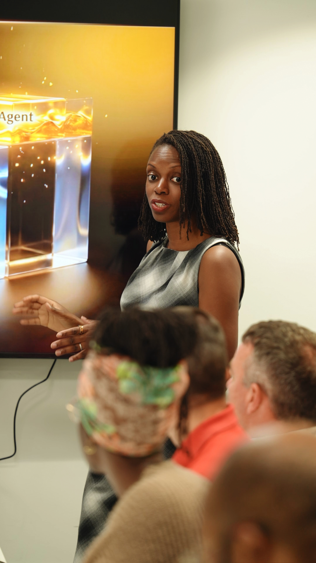 Bisola Fasanya presenting on AI adoption at a business event