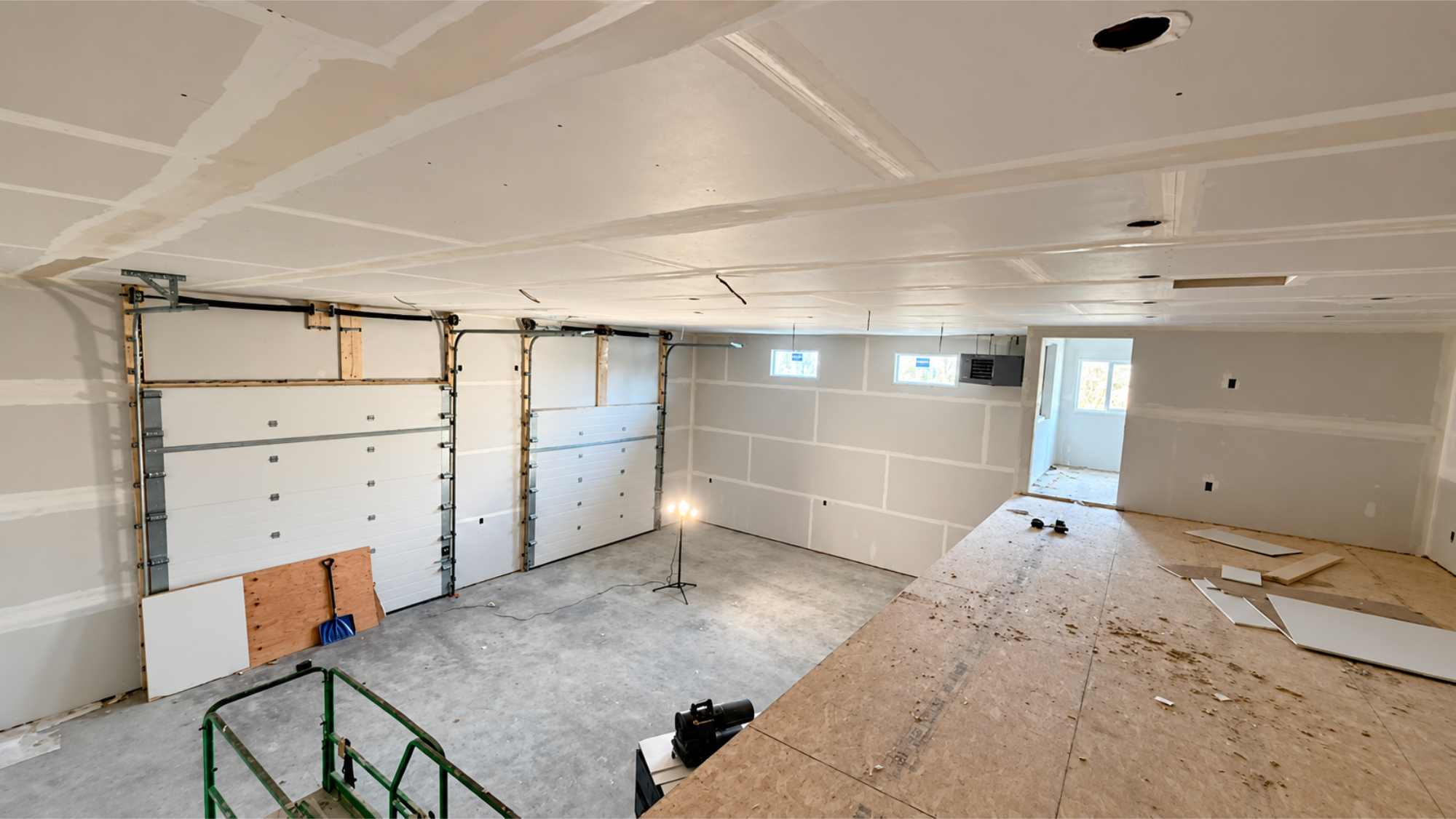 Freshly hung drywall in a shop build-out